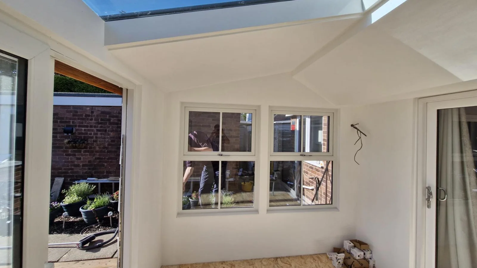 Bespoke timber-clad garden office in a Warwickshire garden, dual-aspect glazing, dedicated workspace inside